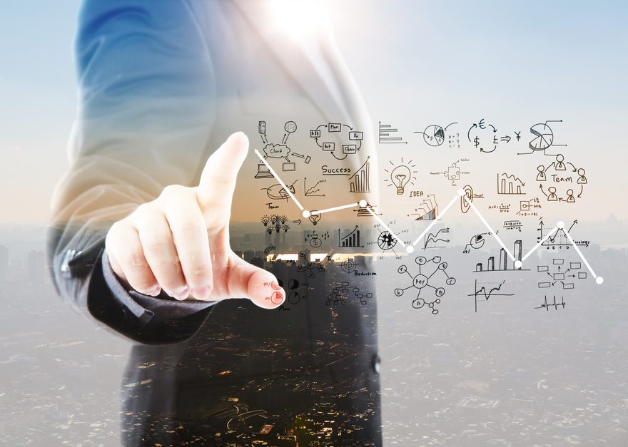 Businessman pointing toward strategy sketches over a city skyline